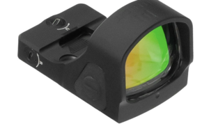 Black reflex sight with a green-tinted lens and mounting base, showing adjustment dial on top side
