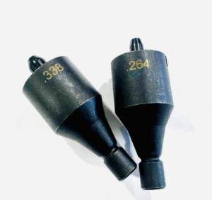 Two black drill bits or countersink bits with gold numbers 338 and 264 resting on a white background.