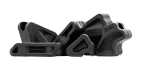 Close-up of a black textured plastic mounting clamp set, with interlocking shapes and the MDT logo visible.